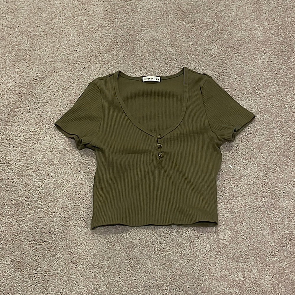 A medium, ribbed, and tight-fitted army green colored top from Cotton On